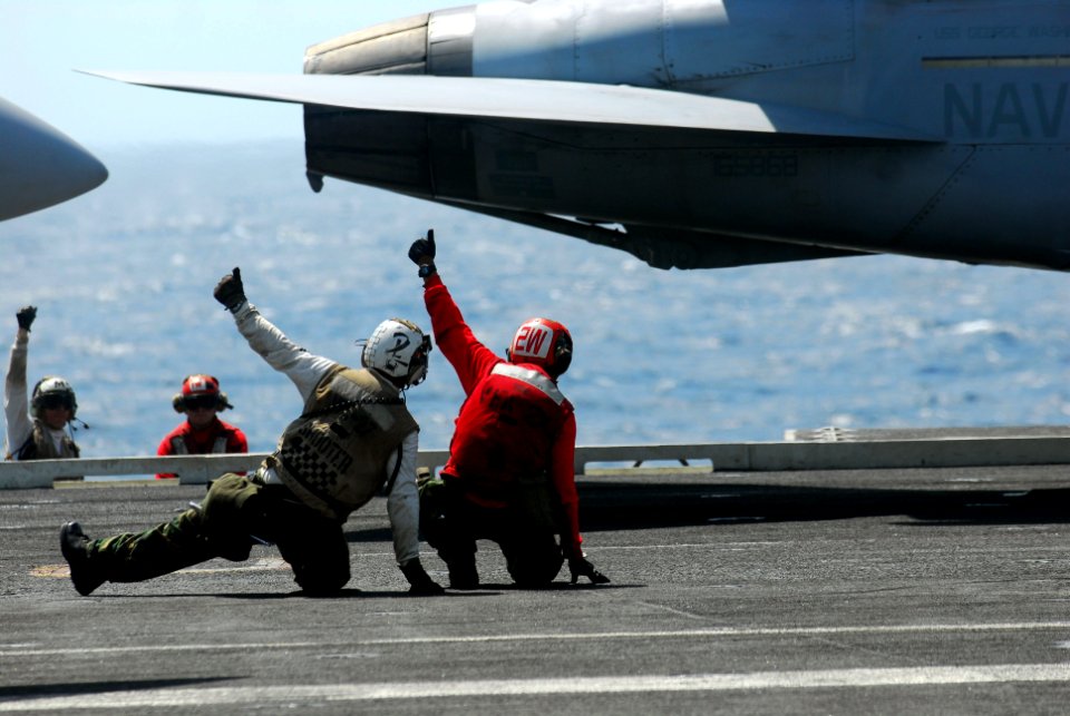 US Navy 110707-N-WW409-113 Sailors give the signal to launch an F-A-18F Super Hornet aboard the aircraft carrier USS George Washington (CVN 73)
