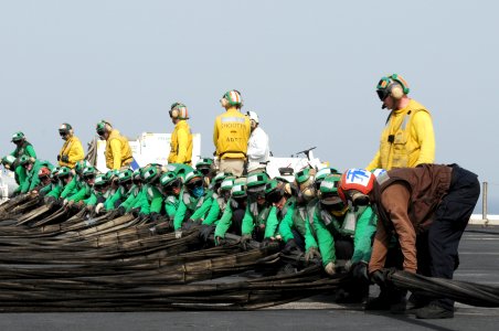 US Navy 110706-N-QL471-133 Sailors set up an emergency barricade during flight deck safety drills aboard the aircraft carrier USS George H.W. Bush