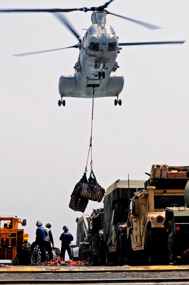 US Navy 110709-N-RC734-024 A CH-46E Sea Knight helicopter delivers supplies to USS Comstock (LSD 45)
