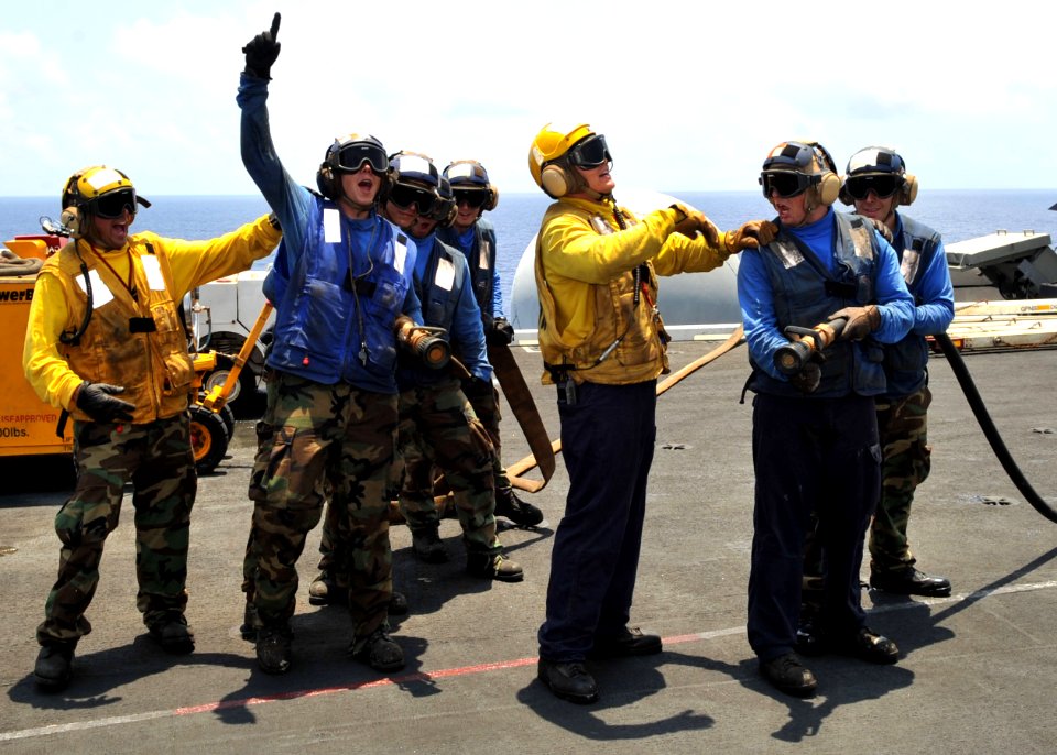 US Navy 110712-N-CH661-019 Sailors conduct a firefighting training exercise aboard USS Enterprise (CVN 65)