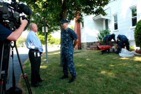 US Navy 110712-N-QE550-006 Your News Now reporter Mike Heeden interviews Lt. Cmdr. Todd Linskey during a community renovation project at two Doors