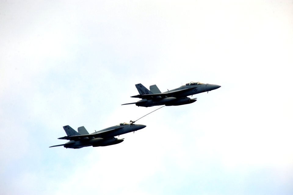 US Navy 110711-N-CH661-115 Two F-A-18 Super Hornets perform aerial combat maneuvers as part of training for a tiger cruise air power demonstration