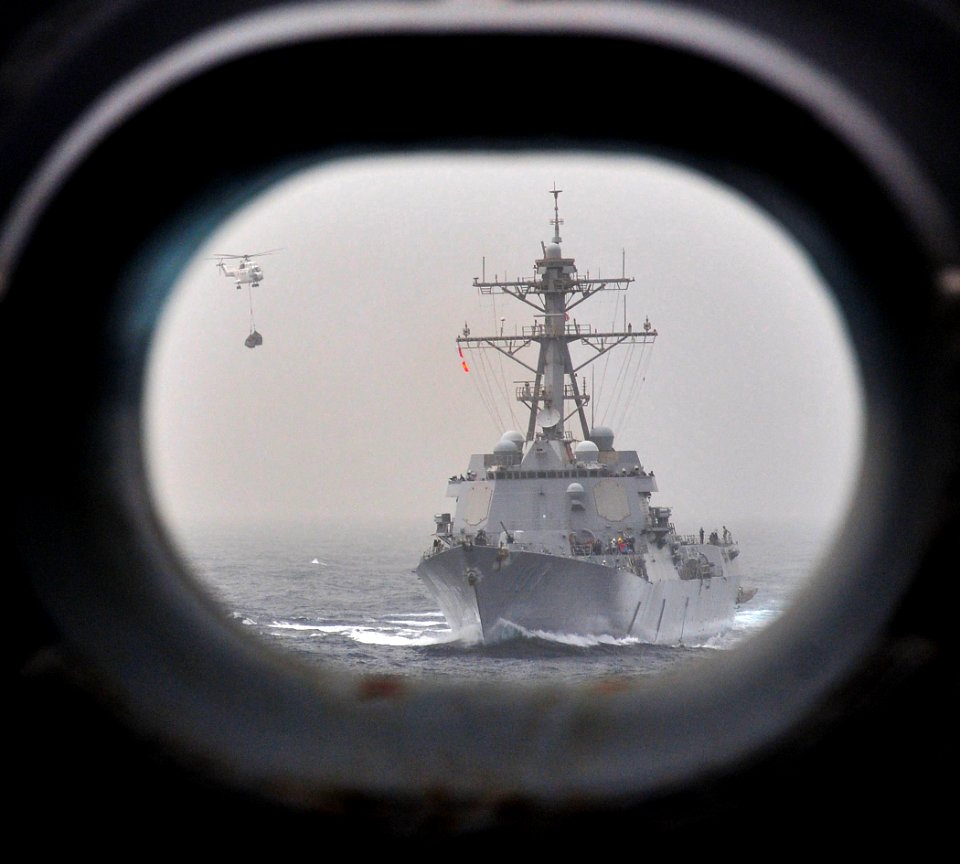US Navy 110711-N-ZS026-237 A helicopter descends to the flight deck aboard the guided-missile destroyer USS Truxton (DDG 103)