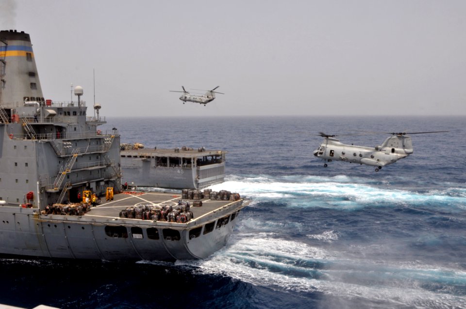 US Navy 110709-N-GW695-161 CH-46 Sea Knight helicopters assigned to the Evil Eyes of Marine Medium Helicopter Squadron (HMM) 163 transfer supplies