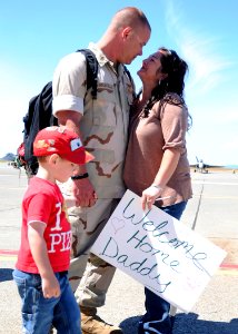 US Navy 110709-N-ZK021-004 Aviation Structural Mechanic 1st Class Ry Vansickle is greeted by family during a homecoming ceremony at Naval Air Stati