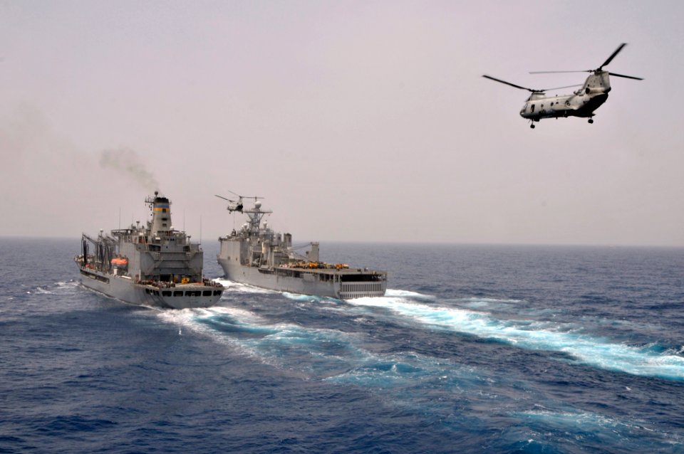 US Navy 110709-N-GW695-104 CH-46 Sea Knight helicopters assigned to the Evil Eyes of Marine Medium Helicopter Squadron (HMM) 163 approach the Milit