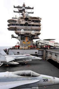 US Navy 110710-N-EE987-341 F-A-18 Hornets are transferred from the hangar bay to the flight deck during an elevator operations evolution on the fli