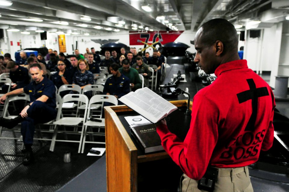 US Navy 110710-N-UO379-183 Cmdr. Darrel Wesley, from Chattanooga, Tenn., command chaplain aboard the aircraft carrier USS Ronald Reagan (CVN 76), l