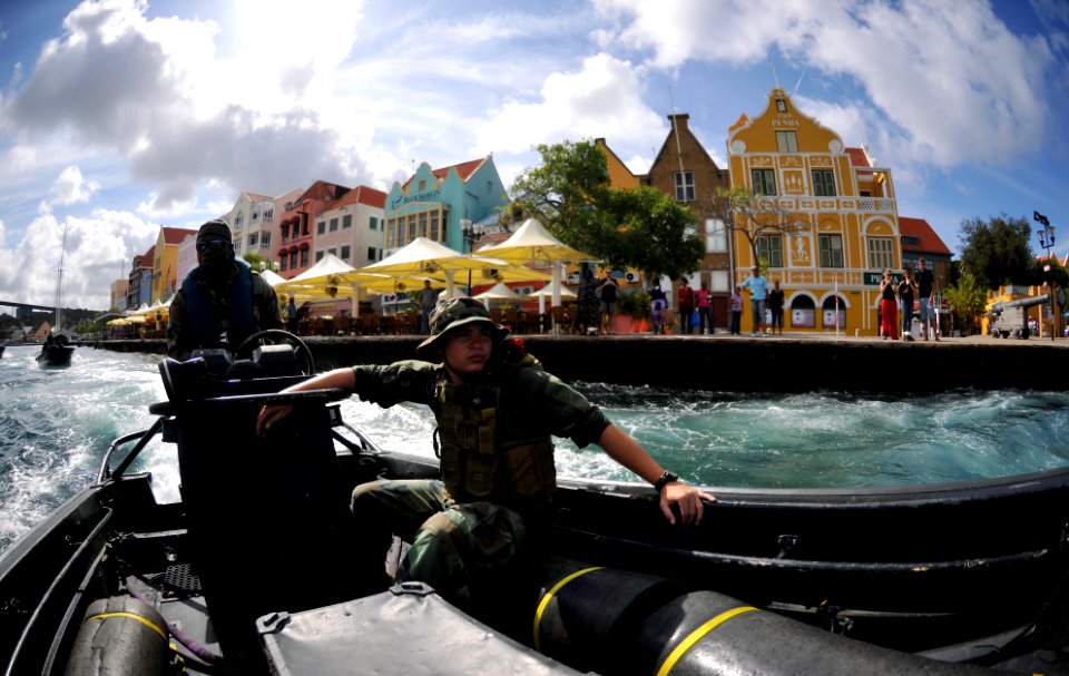US Navy 110707-N-YO394-022 A Dutch marine, left, transits St. Anna Bay as Gunner's Mate 3rd Class Cory Sanchez, assigned to Riverine Squadron (RIVR