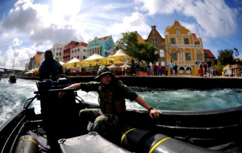 US Navy 110707-N-YO394-022 A Dutch marine, left, transits St. Anna Bay as Gunner's Mate 3rd Class Cory Sanchez, assigned to Riverine Squadron (RIVR