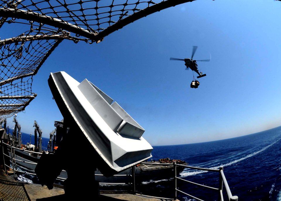 US Navy 110711-N-EC658-010 An MH-60S Sea Hawk helicopter transports pallets to USS Bataan (LHD 5) during a replenishment at sea