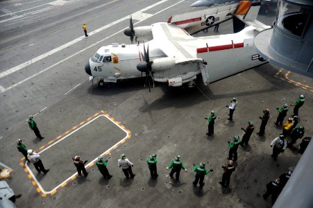 US Navy 110713-N-AU622-068 Sailors aboard the aircraft carrier USS Dwight D. Eisenhower (CVN 69) signal a C-2A Greyhound transport aircraft assigne