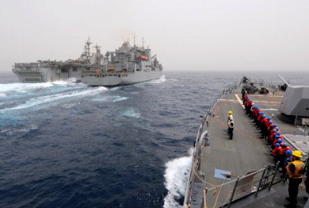 US Navy 110711-N-TB177-457 Sailors aboard the guided-missile destroyer USS Truxtun (DDG 103), right, stand by as the ship approaches the Military S photo