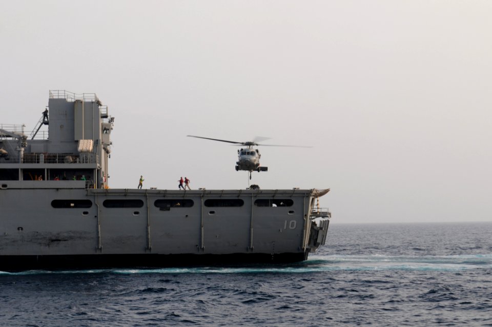 US Navy 110708-N-XQ375-364 An MH-60S Sea Hawk helicopter transfers pallets of stores from the Military Sealift Command fast combat support ship USN