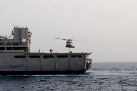 US Navy 110708-N-XQ375-364 An MH-60S Sea Hawk helicopter transfers pallets of stores from the Military Sealift Command fast combat support ship USN