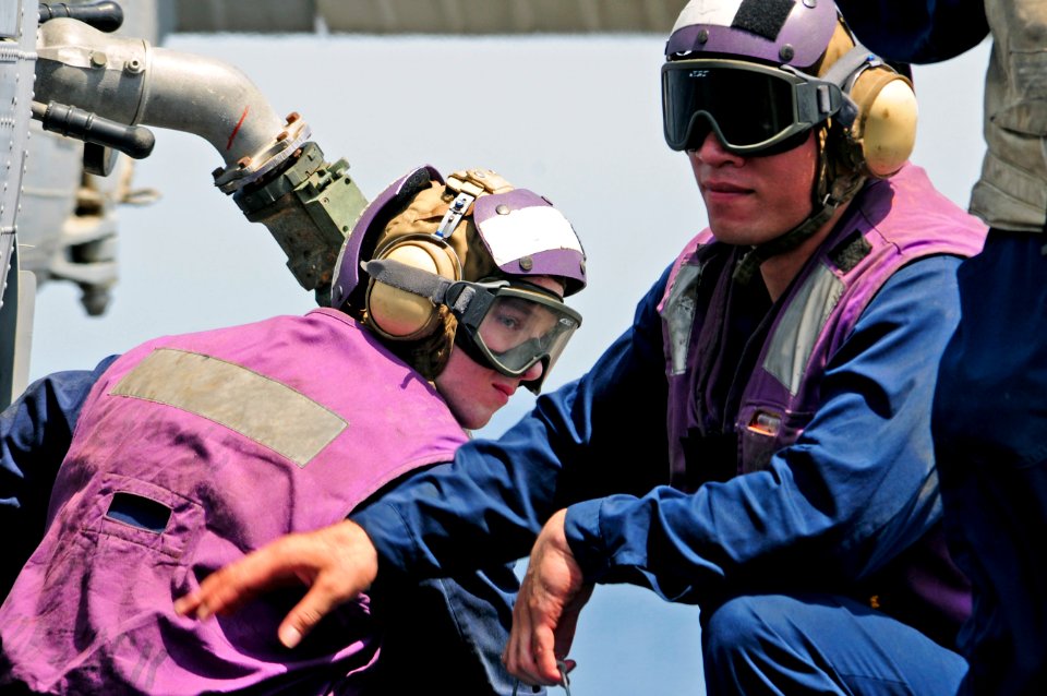 US Navy 110714-N-RC734-062 Sailors fuel an MH-60S Sea Hawk helicopter aboard the amphibious dock landing ship USS Comstock (LSD 45)