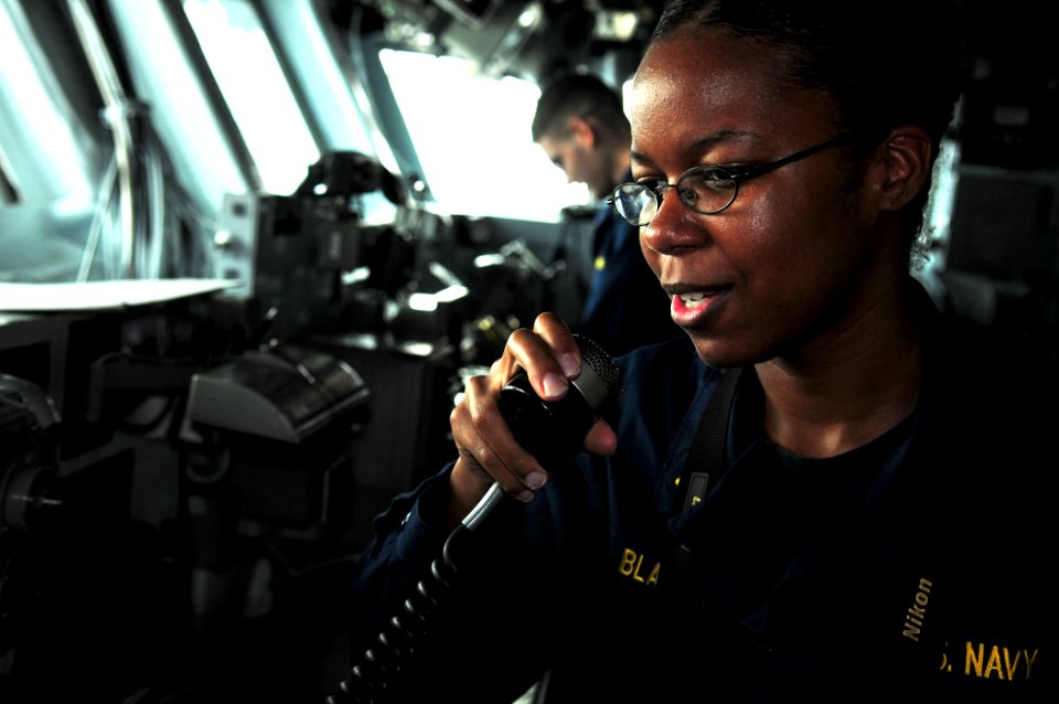 US Navy 110711-N-ZS026-480 Ensign Thereasa Marie Black makes an announcement over the ship's 1MC from the bridge of the amphibious assault ship USS