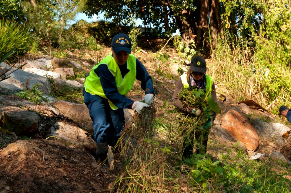 US Navy 110712-N-CZ945-116 A Sailor and Daniela Kupschus pick weeds along Ithaca Creek's shoreline during a community service event at Purtell Park