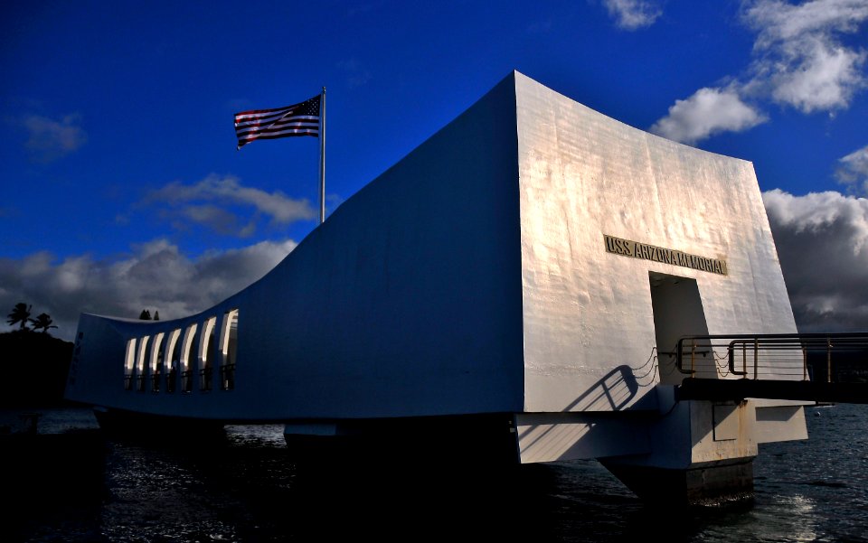 US Navy 110715-N-RI884-336 Sunlight illuminates the USS Arizona Memorial at Joint Base Pearl Harbor-Hickam during a scheduled reenlistment ceremony