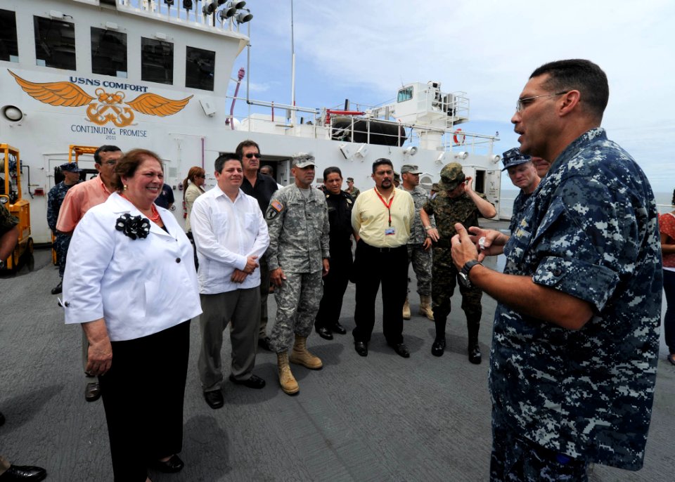 US Navy 110715-N-QD416-227 Commodore Brian Nickerson, mission commander of Continuing Promise 2011, explains the flight deck of Military Sealift Co