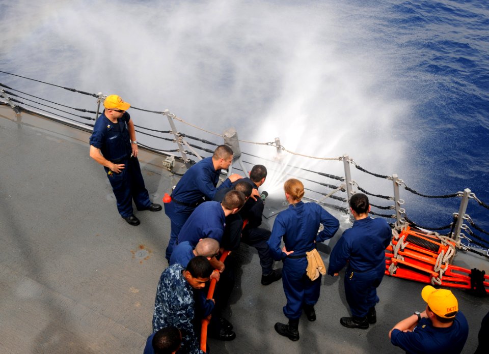 US Navy 110713-N-TB177-115 Sailors conduct hose-handling training aboard the guided-missile destroyer USS Truxtun (DDG 103) photo