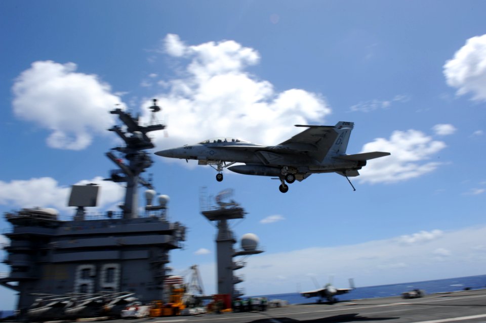 US Navy 110715-N-DE843-217 An F-A-18F Super Hornet assigned to the Gladiators of Strike Fighter Squadron (VFA) 106 flies over the flight of aircraf