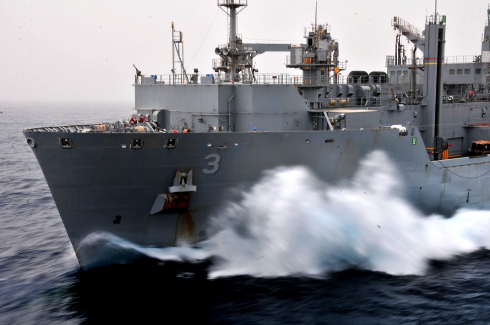 US Navy 110711-N-ZS026-439 Waves crash against the bow of the Military Sealift Command dry cargo and ammunition ship USNS Alan Shepard (T-AKE 3)