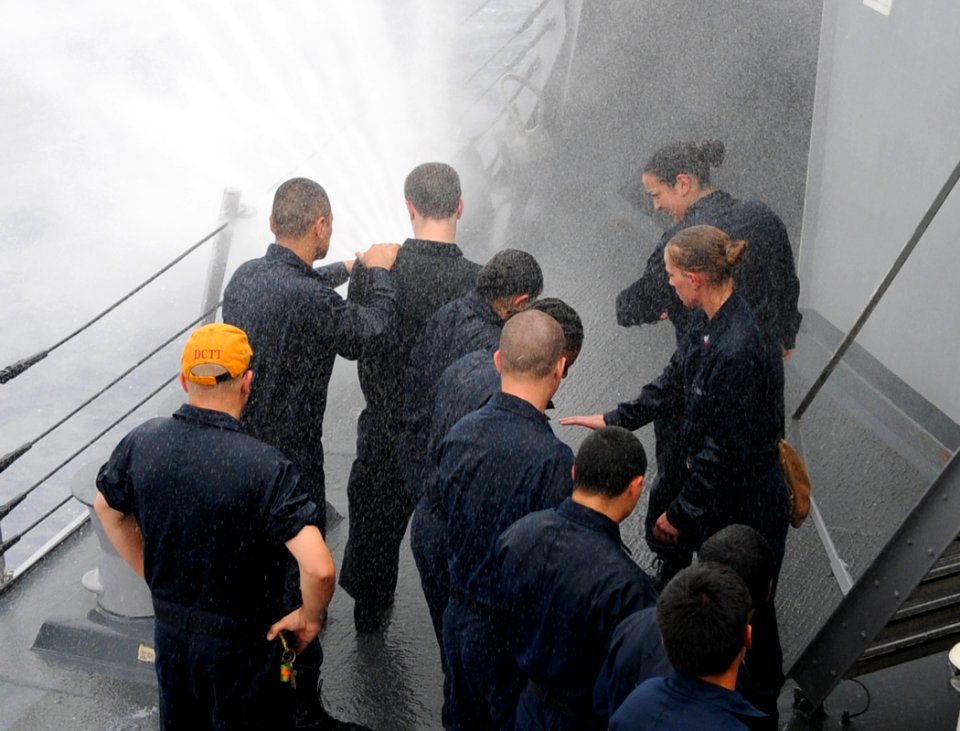US Navy 110713-N-TB177-232 Sailors conduct hose-handling training aboard the guided-missile destroyer USS Truxtun (DDG 103)