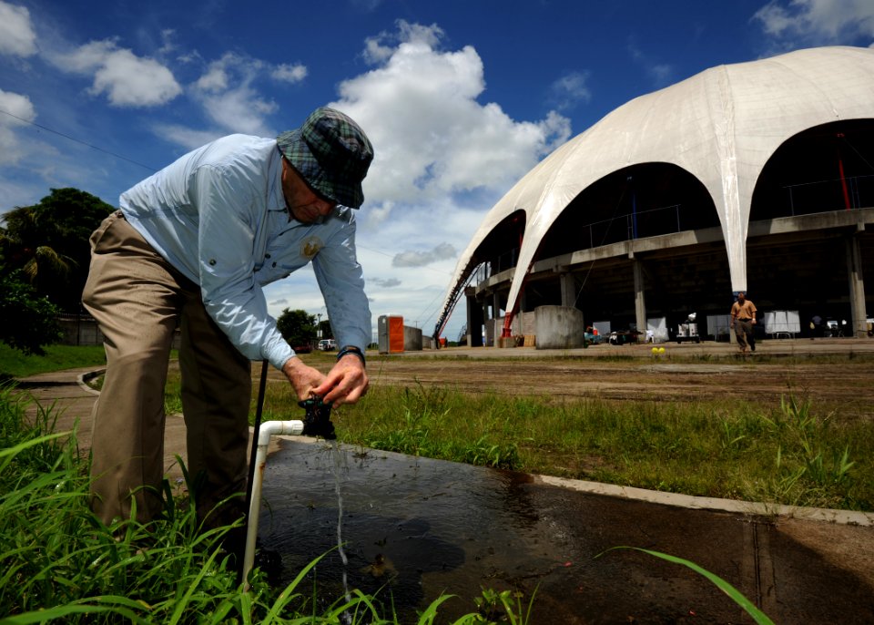 US Navy 110716-N-NY820-123 Latter-day Saints Charities volunteer Ken Kartchner, from Provo, Utah, takes a water sample for the Continuing Promise 2