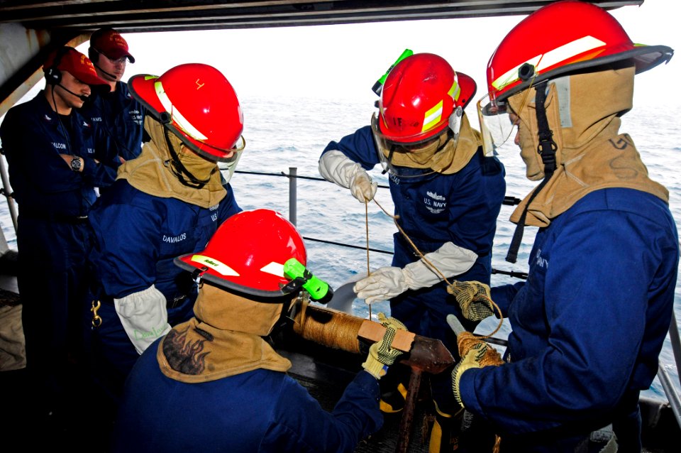 US Navy 110712-N-JO245-054 Damage controlmen assigned to the flying squad abord the aircraft carrier USS George Washington (CVN 73) apply marlin li