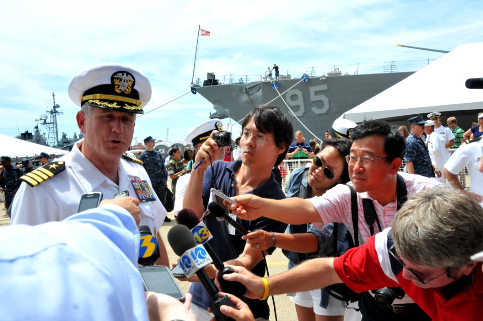 US Navy 110715-N-QY430-181 Capt. Dee Mewbourne, commanding officer of the aircraft carrier USS Enterprise (CVN 65), responds to questions by the me