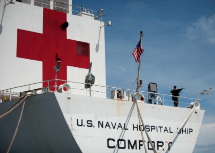 US Navy 110714-N-NY820-047 A Sailor stands watch aboard the Military Sealift Command hospital ship USNS Comfort (T-AH 20) photo