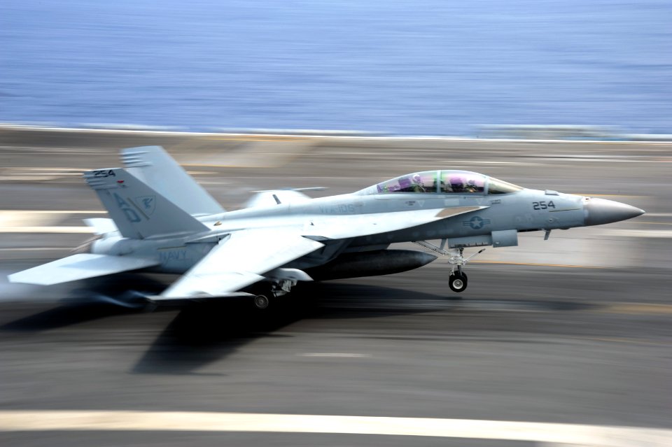 US Navy 110713-N-AU622-065 An F-A-18F Super Hornet assigned to the Gladiators of Strike Fighter Squadron (VFA) 106 lands aboard the aircraft carrie