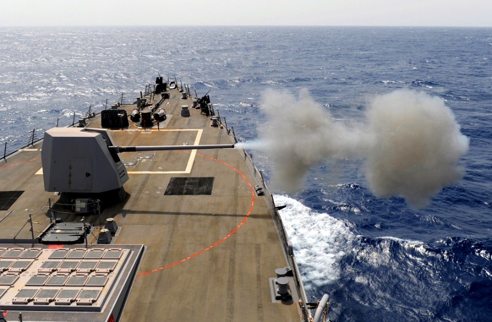 US Navy 110712-N-TB177-022 The guided-missile destroyer USS Truxtun (DDG 103) fires its 5-inch-54-caliber (Mk 45) lightweight gun during a live-fir