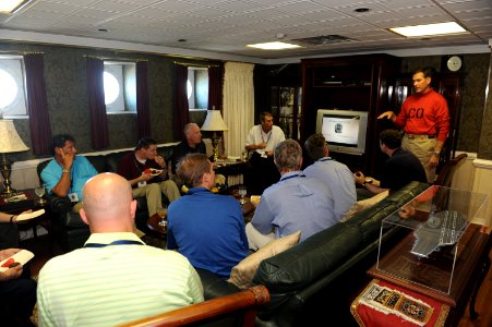 US Navy 110718-N-AU622-112 Capt. Marcus Hitchcock, commanding officer of the aircraft carrier USS Dwight D. Eisenhower (CVN 69), speaks to distingu