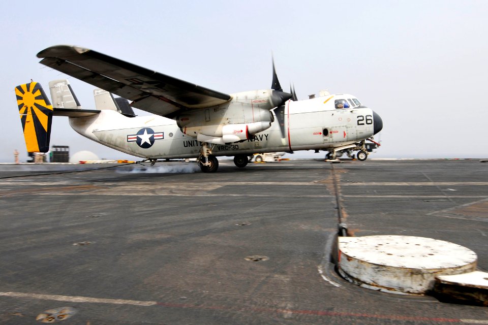 US Navy 110718-N-EE987-140 A C-2A Greyhound assigned to the Providers of Fleet Logistics Combat Support Squadron (VRC) 30 lands aboard the aircraft