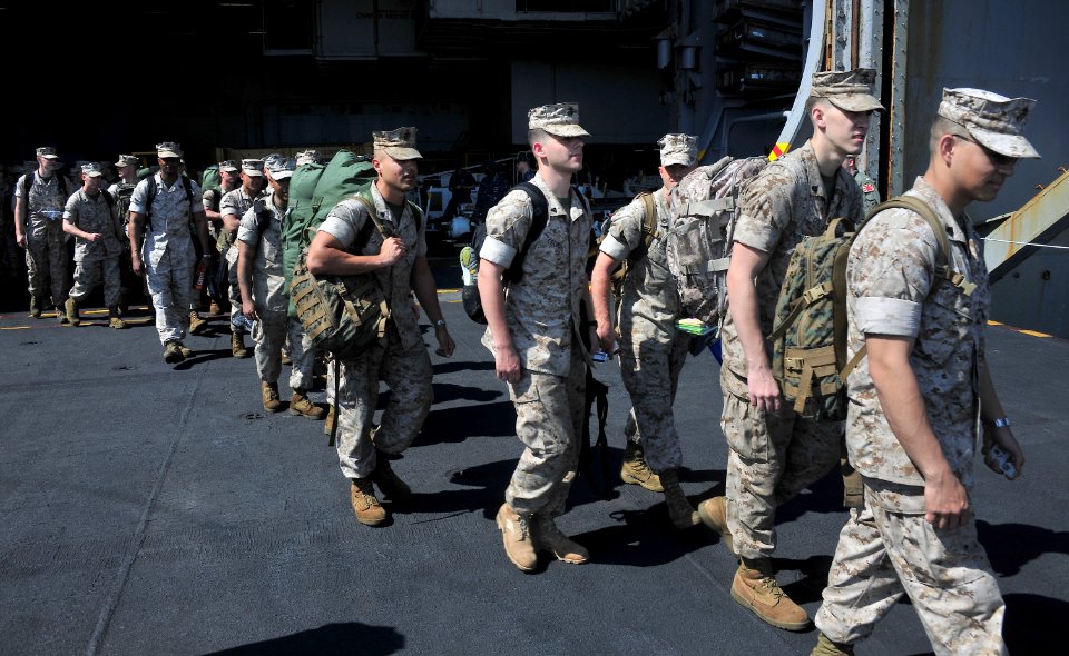 US Navy 110713-N-OP638-015 Marines assigned to the Thunderbolts of Marine Fighter Attack Squadron (VMFA) 251 depart the aircraft carrier USS Enterp