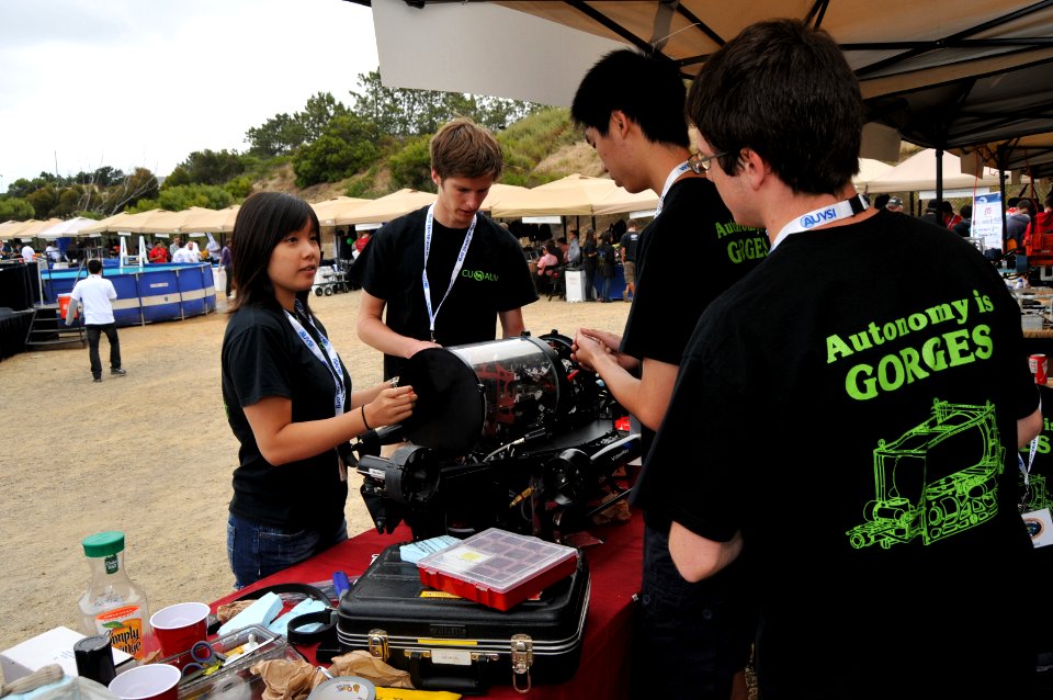 US Navy 110713-N-UN340-022 Cornell University students perform surface checks on their autonomous underwater vehicle, Drakar, during practice runs