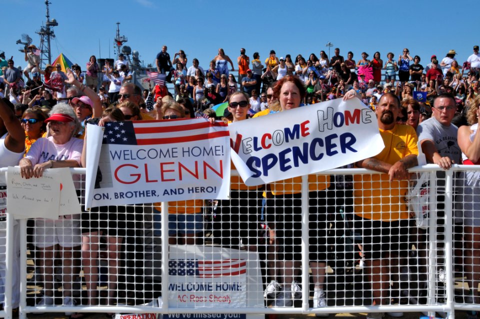 US Navy 110715-N-QY430-019 Family and friends await the arrival of the aircraft carrier USS Enterprise (CVN 65) to Naval Station Norfolk after a si