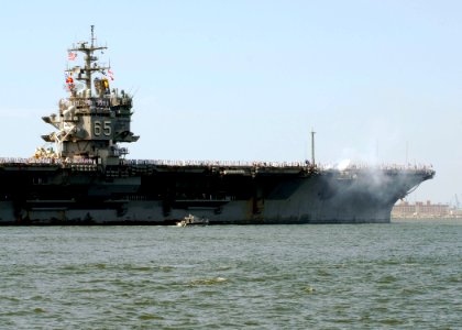US Navy 110715-N-YC845-556 Sailors aboard the aircraft carrier USS Enterprise (CVN 65) fire a 40mm saluting battery as the ship prepares to cross o