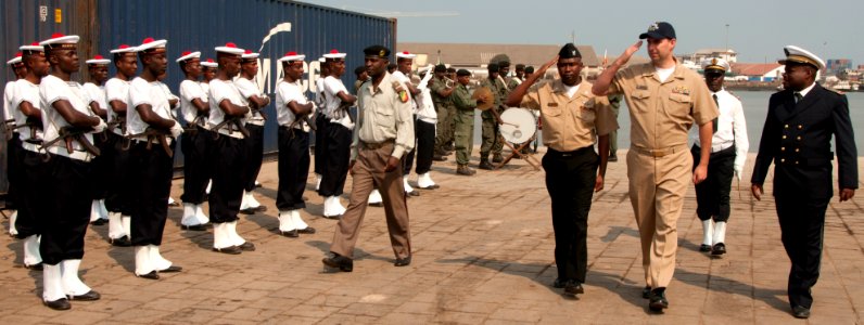 US Navy 110717-N-XK513-086 Lt. Cdr. Charles Eaton, officer in charge of High Speed Vessel Swift, salutes members of the Congolese military during a