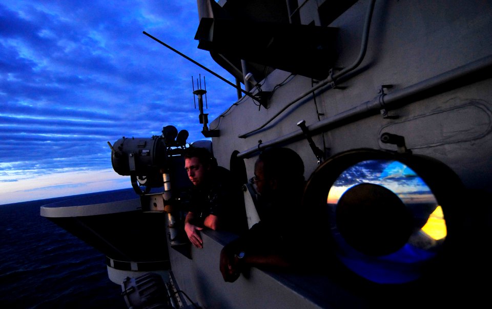 US Navy 110719-N-MH885-004 Seaman Apprentice Brett Donaldson and Seaman Daniel Branham stand forward lookout watch at sunrise
