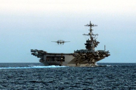 US Navy 110718-N-IO627-186 An E-2C Hawkeye approaches the aircraft carrier USS George Washington (CVN 73) after participating in a simulated air st