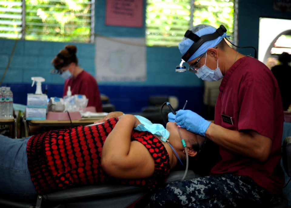 US Navy 110717-N-NY820-078 Hospital Corpsman 1st Class Darwin Flores, from San Salvador, El Salvador, performs a dental cleaning during a Continuin