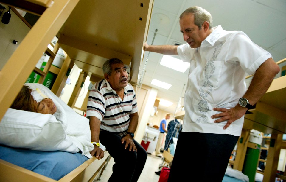 US Navy 110719-N-RM525-316 Sigfrido Reyes, president of the Legislative Assembly of El Salvador, meets with Salvadoran patients aboard the Military