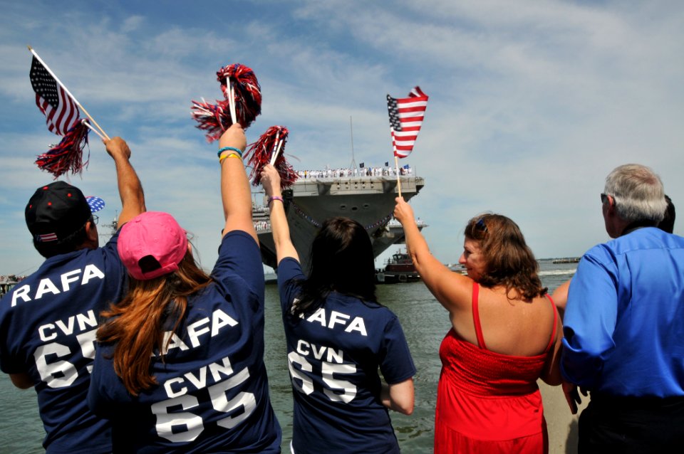 US Navy 110715-N-QY430-162 Family and friends await the arrival of the aircraft carrier USS Enterprise (CVN 65) to Naval Station Norfolk