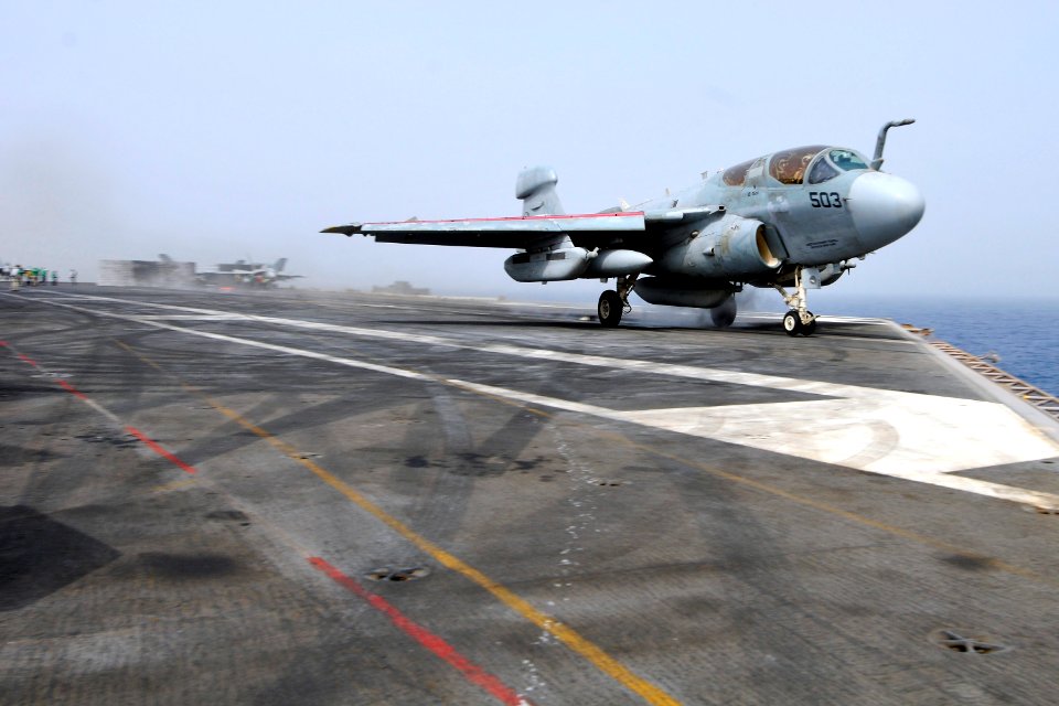 US Navy 110718-N-EE987-008 Sgt. Anthony Rumlin, from Tampa, Fla., removes a prox switch from the landing gear assembly of an F-A-18 Hornet aboard t