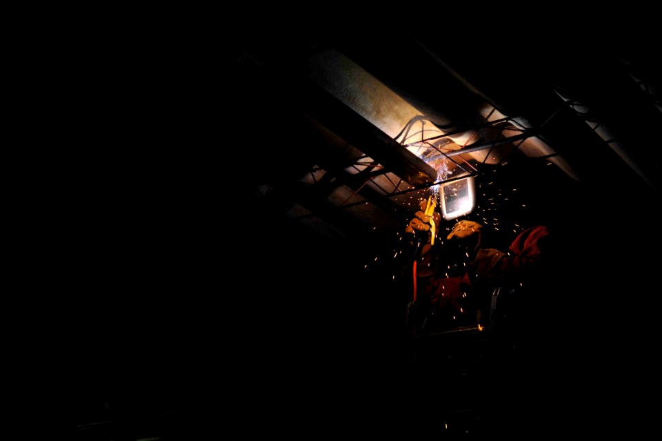 US Navy 110717-F-NJ219-074 Steelworker 1st Class Stuart Denner, from Shiro, Texas, welds metal at Escuela Canton Miravalle during a Continuing Prom