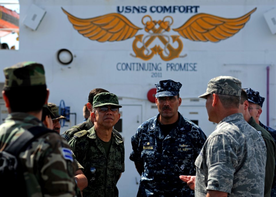 US Navy 110718-N-NY820-067 Commodore Brian Nickerson, mission commander for Continuing Promise 2011, center, leads military members of the Attache