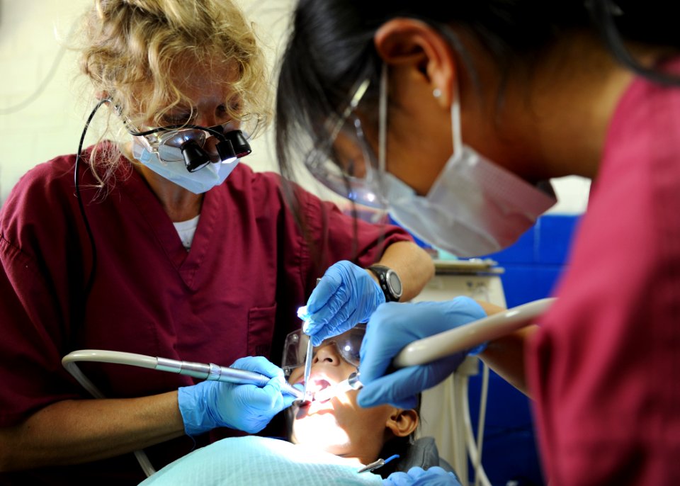 US Navy 110718-N-QD416-148 Dr. Braille Watson and Mindy Li, volunteers from the University of California San Diego Pre-dental Society